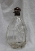 A George V silver topped and glass spirit flask, of tear drop shape,