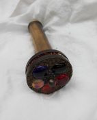 A brass kaleidoscope, with a brass viewing tube,