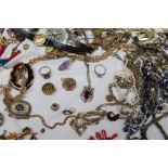 Assorted costume jewellery including bracelets, necklaces, brooches,