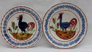 A Llanelly pottery side plate decorated with a blue cockerel, the border decorated with flowers, 17.