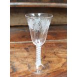 An 18th century wine glass,