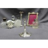 An Edward VII silver taper stick, with a removable sconce and multi knopped stem on a stepped base,