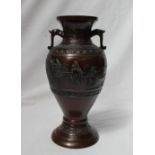 A Japanese bronze twin handled baluster vase,