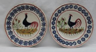 A Llanelly pottery side plate decorated with a blue cockerel, the border decorated with flowers,
