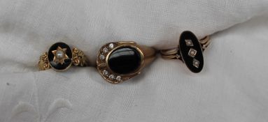 A 9ct yellow gold onyx and paste set dress ring together with two other onyx set rings