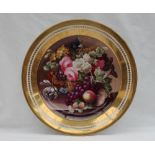 A Swansea porcelain plate painted with a vase of flowers and fruit on a plinth,