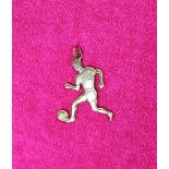 A 9ct yellow gold pendant in the form of a footballer,