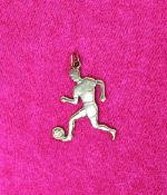 A 9ct yellow gold pendant in the form of a footballer,