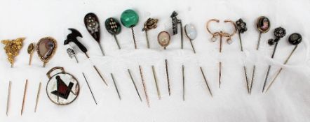 A malacite ball stick pin together with opal set stick pins,