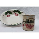 A South Wales Pottery water basin, painted with cherries on a branch to a green line border,