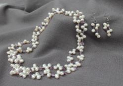 An oval pearl and amethyst two strand necklace,