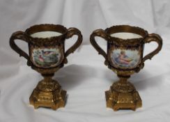 A pair of 19th century continental porcelain and ormolu mounted twin handled vases,