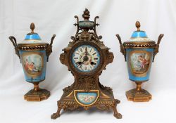 A 19th century French gilt spelter and Sevres style porcelain clock garniture,