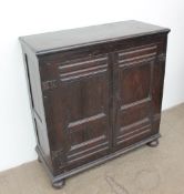 An 18th century oak side cabinet,