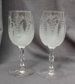 A pair of 19th century engraved glass wine glasses,