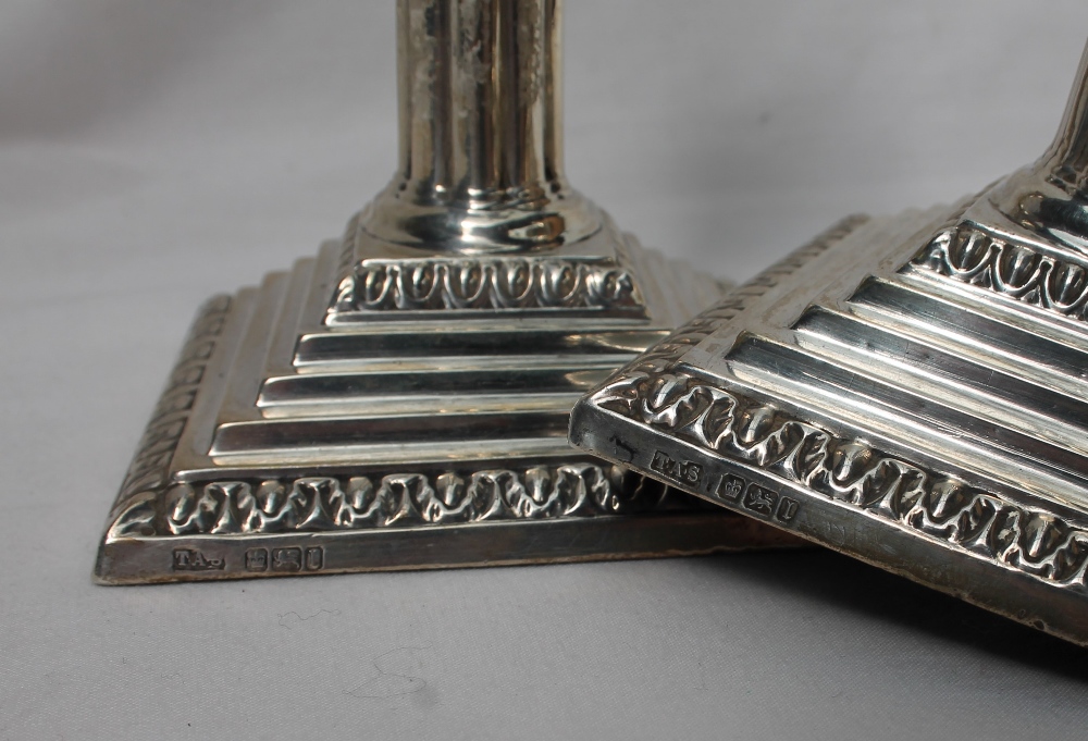 A pair of Edwardian silver candlesticks, - Image 2 of 2