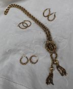 A 9ct yellow gold sliding knot pendant, on a 9ct gold chain,