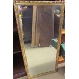 A large gilt framed wall mirror