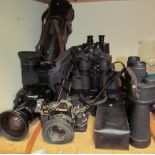 An Olympus IS3000 camera together a Canon A-1 camera, lenses,