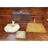A Mappin & Webb lizard skin handbag together with a crocodile skin clutch and two other bags