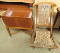 A folding chair together with a walnut chest on stand