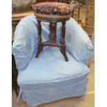 A 19th century upholstered tub chair together with a piano stool with pad seat and turned legs