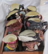 A collection of Royal Doulton character jugs including Smuggler, Long John Silver,