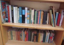 A collection of books including the Living Planet, reference books, history books,