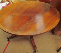 A reproduction mahogany coffee table of circular form
