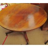 A reproduction mahogany coffee table of circular form