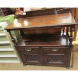 An early 20th century oak buffet with a raised back,