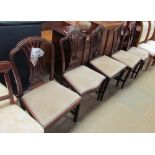 A matched set of five mahogany dining chairs with pierced vase splats and drop in seats