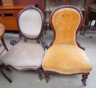 A Victorian mahogany framed nursing chair together with another nursing chair