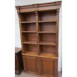 A pair of large 20th century bookcases with a moulded cornice, the one with a pair of glazed doors,