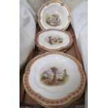 A 19th century dessert set painted with landscape scenes to a scalloped edge with pink,