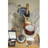 A bottle of Drappier champagne together with glass decanters,