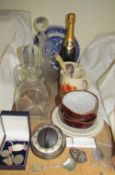 A bottle of Drappier champagne together with glass decanters,