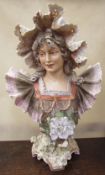A Royal Dux portrait bust of a young lady in a frilly dress, raised triangle mark,