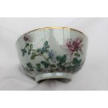 A Chinese polychrome decorated porcelain bowl, decorated with flowerheads and leaves,