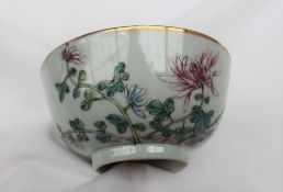 A Chinese polychrome decorated porcelain bowl, decorated with flowerheads and leaves,