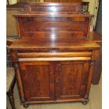 A Victorian mahogany chiffonier with a raised back and shelf, the base with a rectangular top,