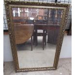 A gilt framed wall mirror