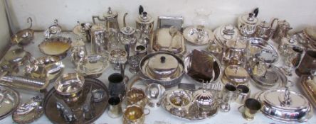 A large quantity of electroplated wares including part tea sets, entree dishes and covers,