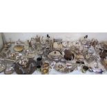 A large quantity of electroplated wares including part tea sets, entree dishes and covers,