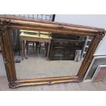 A large gilt framed wall mirror