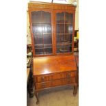 A 20th century walnut bureau bookcase