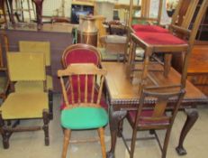 A 20th century mahogany extending dining table together with a set of four chairs,