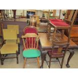 A 20th century mahogany extending dining table together with a set of four chairs,