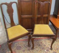 A set of four Queen Anne style mahogany dining chairs