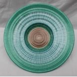 A Shelley pottery charger, with a spiralling green and blue sprayed pattern, printed mark, No.